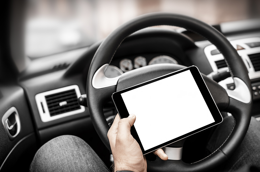 Car Driver With The Tablet Pc